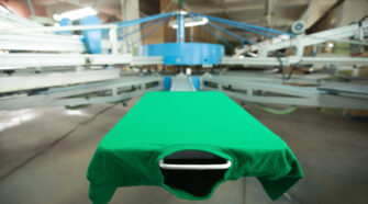 Green t-shirt silk screen printing machine, look of the mock up tshirt before printing process, horizontal image